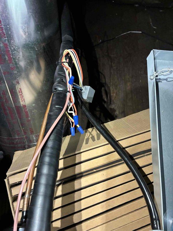Responded to service call for thermostat error message indicating system malfunction with elevated indoor temperature. Performed diagnostic inspection of outdoor condensing unit and indoor air handler components, accessing both exterior cabinet and attic installation to evaluate electrical connections, refrigerant lines, and mechanical operation. System inspection completed with documentation of equipment condition and component accessibility for ongoing service needs.