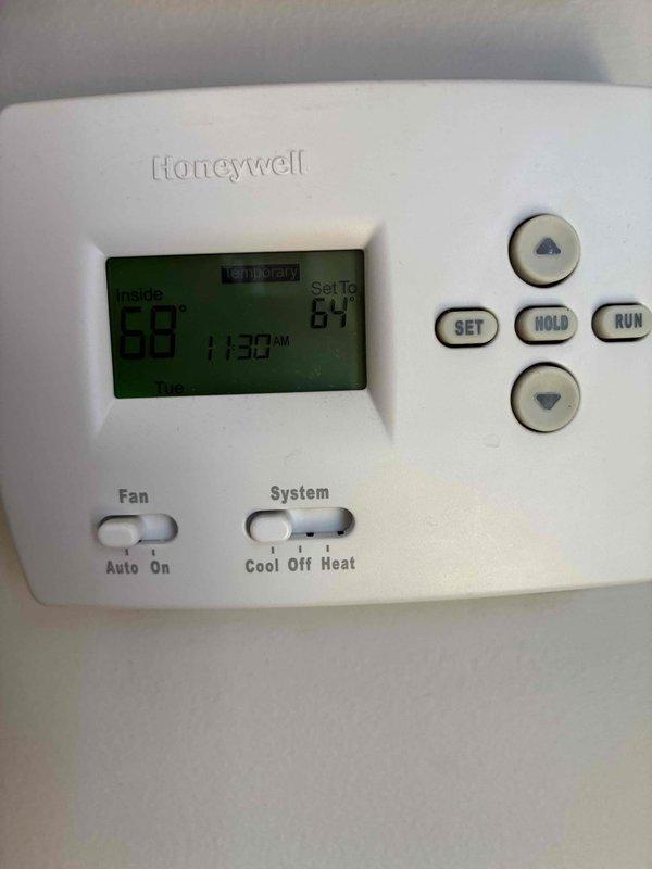 Completed preventive maintenance tune-up on residential HVAC system. Verified system pressures and temperatures using refrigerant manifold gauge, with readings showing 0.5 psig on low side and 286.8 psig on high side, superheat at 3.39°F, and return air temperature at 79.1°F. Confirmed thermostat operation and programming, with unit maintaining proper temperature control and cycling correctly between set points.