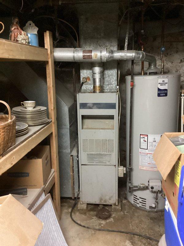 Responded to no cooling complaint on 10+ year old residential air conditioning system. Upon arrival, found first floor thermostat with non-functioning buttons affecting system operation. Accessed basement furnace and outdoor condensing unit to perform diagnostic testing. Connected manifold gauges to condenser service ports to check refrigerant pressures and system performance. Evaluated airflow, temperature differential, and overall system operation. Identified thermostat malfunction as primary issue preventing proper cooling on first floor. Recommended thermostat replacement to restore full system functionality and proper temperature control.