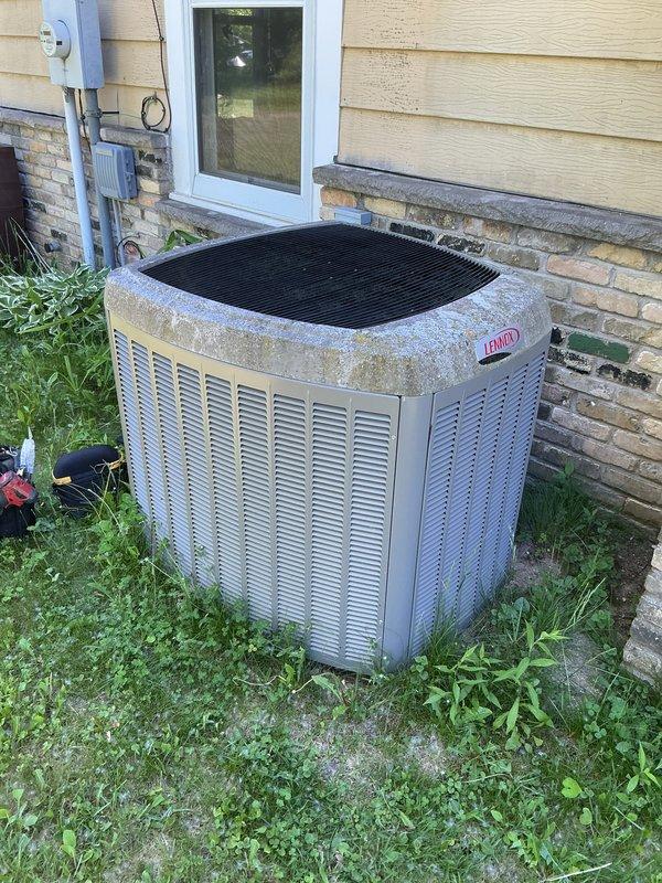 Completed scheduled cooling system maintenance visit under membership agreement. Performed comprehensive A/C tune-up on Lennox outdoor condenser unit and Carrier indoor air handler system. Inspected condenser cabinet noting significant weathering, surface oxidation, and mineral deposits on exterior panels consistent with extended outdoor exposure. Verified unit operation, checked refrigerant lines, electrical connections, and drainage systems. Examined indoor furnace and air handler components, confirmed proper PVC venting and condensate drainage configuration. All systems operational and functioning within normal parameters at time of service completion.