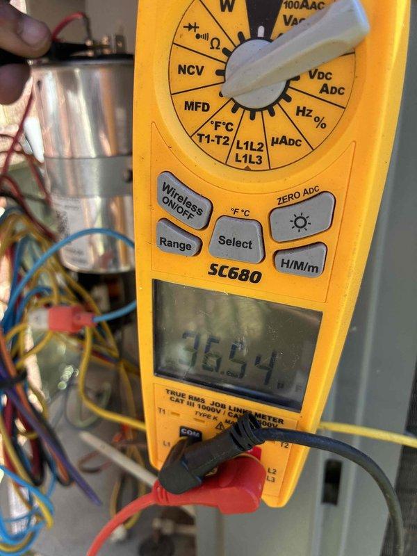 Completed annual air conditioning tune-up maintenance including full system inspection and performance testing. Verified supply air temperature at 122°F and tested capacitor functionality, measuring 36.54 microfarads, which falls within acceptable operating range. Inspected air purification system as requested and confirmed all components operating properly.