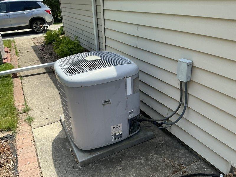 Provided estimate for replacement of existing Payne brand outdoor condensing unit (AC2-4) currently operational but experiencing refrigerant leak. Assessed unit condition, documented existing installation including electrical disconnect and concrete pad placement, and prepared replacement specifications for customer approval.