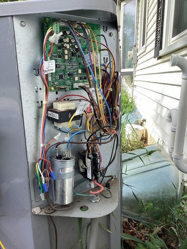 Responded to service call for continuously running HVAC system with 40+ year old equipment. Upon inspection, found evaporator coil severely frozen with heavy ice accumulation, measuring 64°F surface temperature. Diagnosed issue as likely caused by restricted airflow, low refrigerant charge, or failed control board preventing proper system cycling. Inspected outdoor unit control panel revealing disorganized wiring, aging capacitor, contactor, and transformer. Due to advanced age of equipment and extent of freeze-up, recommended system evaluation after thaw and potential replacement given the unit's age exceeding typical service life expectancy.