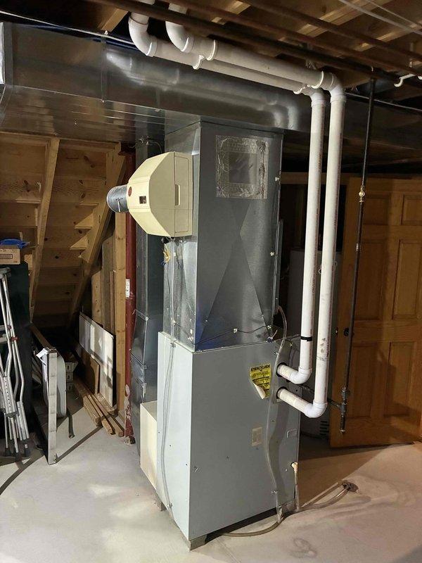 Conducted on-site estimate for complete HVAC system replacement in residential basement location. Evaluated existing furnace and air conditioning system, documented current equipment configuration including humidifier attachment and PVC condensate drainage lines. Reviewed customer's financing options and provided comprehensive replacement proposal for new heating and cooling equipment.