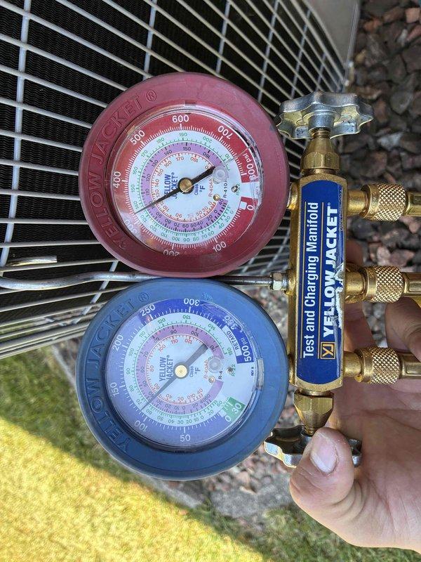 Completed prepaid membership cooling maintenance visit on residential HVAC system. Performed comprehensive inspection of indoor furnace unit and outdoor condensing unit, verified refrigerant pressures using manifold gauge set with readings within manufacturer specifications. Documented equipment condition with photos showing proper installation and operational status of Carrier system components, confirmed all safety labels present and system operating normally for continued seasonal cooling performance.
