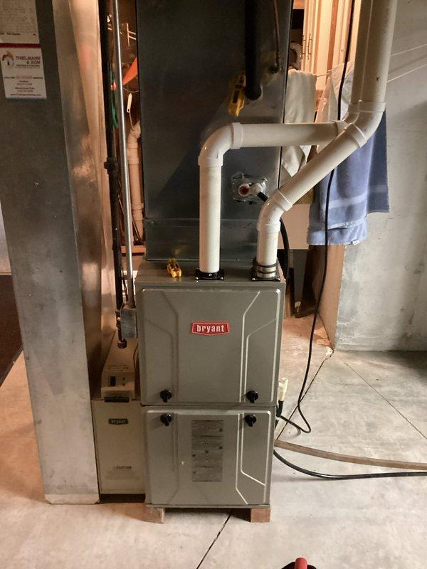 Responded to no cooling complaint with loud buzzing sound from Bryant HVAC system. Upon arrival, performed diagnostic inspection of furnace and air handling components in basement utility area. Identified source of buzzing noise and resolved cooling issue, restoring normal system operation.