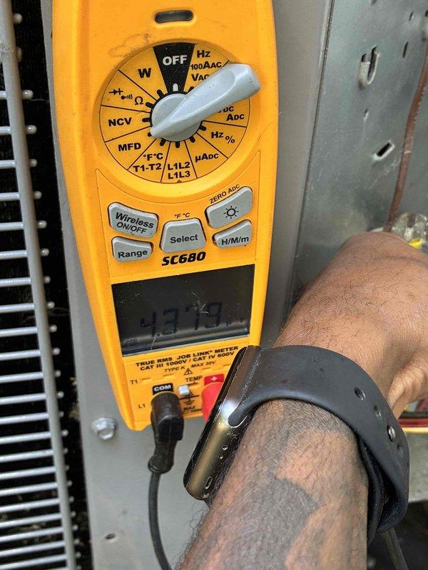 Completed comprehensive furnace tune-up including full system diagnostics and performance verification. Utilized SC680 multimeter to test electrical components, measure voltage levels, and verify capacitor functionality on the outdoor condensing unit. Inspected and assessed all internal electrical connections, circuit board operation, and compressor components with access panel removed for thorough evaluation. All systems tested within normal operating parameters and unit returned to service.