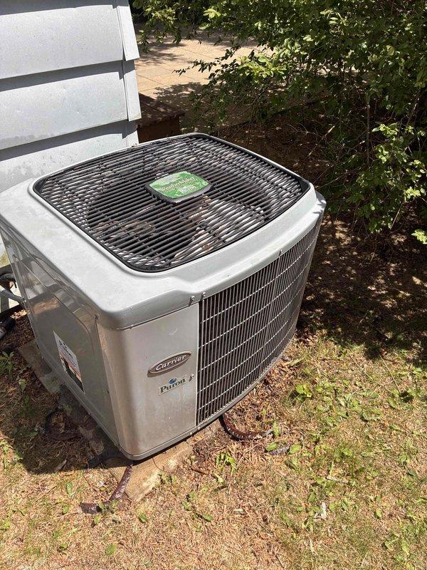 Performed comprehensive AC tune-up on Carrier condenser unit, including system inspection and performance verification. Supply air temperature measured at 59.5°F, confirming proper cooling operation and system functionality.