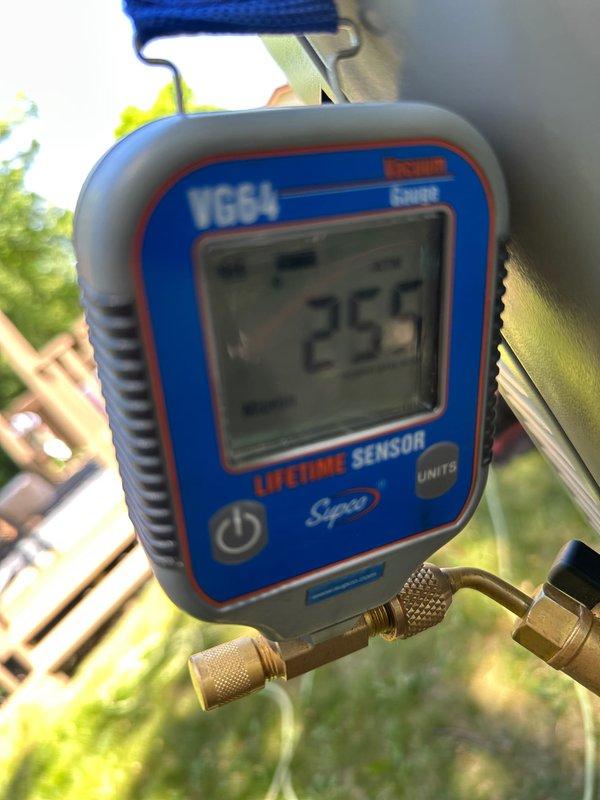 # HVAC Complete System Installation

Completed full residential HVAC system replacement including new furnace, air conditioning unit, and S40 programmable thermostat. Installed Patriot adapter for PVC venting connection and reused existing filter cabinet to maintain system efficiency. Routed copper refrigerant lines and electrical wiring through confined space between structure and equipment pad. Performed system startup, verified electrical connections at outdoor control panel, and conducted diagnostic testing. System pressures measured at 256 PSI using calibrated refrigeration gauge, confirming proper refrigerant charge and optimal operating parameters. All components tested and operational upon completion.