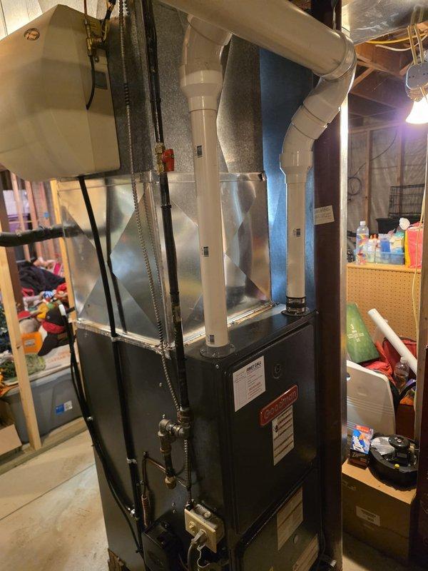 Completed full air conditioning and evaporator coil replacement in residential basement utility area. Removed existing equipment and installed new A/C system with matching indoor coil unit mounted atop existing furnace. Connected copper refrigerant lines with proper bends and routing, integrated new coil with existing ductwork using metallic transitions and proper insulation wrap. Verified all electrical connections, tested system operation, and confirmed proper airflow through supply plenum. Installation meets manufacturer specifications and local code requirements.