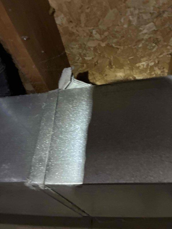 Responded to service call for newly installed ductwork system producing abnormal noise. Upon inspection, identified improper joint connection in attic ductwork with visible separation and inadequate sealing at metal duct junction. Repaired and resealed ductwork joints with proper mastic application to eliminate air leaks and vibration noise, ensuring system operates quietly and efficiently within manufacturer specifications.