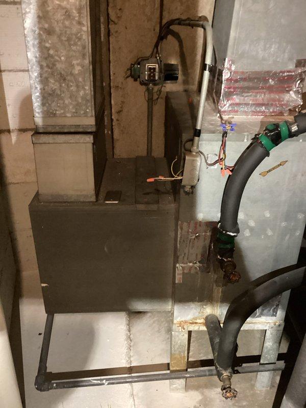 Responded to no cooling call on residential HVAC system over 10 years old. Upon arrival, performed diagnostic inspection of furnace and air conditioning components in basement mechanical room. Assessed electrical connections, refrigerant lines, condensate drainage system, and control wiring throughout the installation. System evaluation completed during specified afternoon service window, with photographic documentation taken of equipment condition and mechanical room layout for service records.