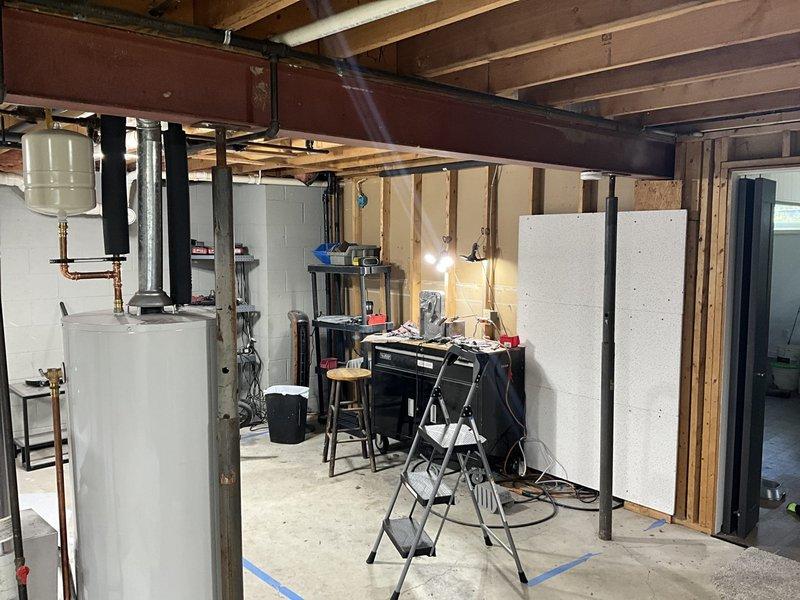 Provided estimate for complete HVAC system conversion from existing boiler heating system to forced air furnace and air conditioning in unfinished basement. Assessed current mechanical room layout, existing ductwork requirements, and equipment placement options for new forced air system installation. Also evaluated dryer vent routing feasibility for proposed laundry relocation to upper level.