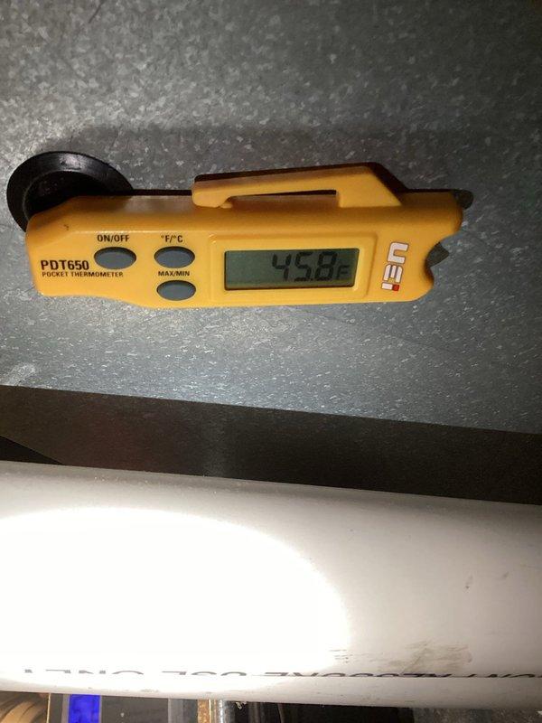 Completed comprehensive A/C tune-up service on residential cooling system. Performed temperature measurements using calibrated digital thermometer, recording ambient conditions at 73.48°F. Inspected basement mechanical equipment including ductwork, refrigerant lines, and associated plumbing connections to ensure proper system operation and identify any maintenance concerns.