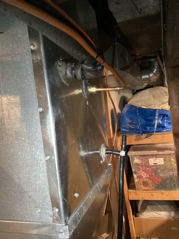 Completed comprehensive A/C tune-up service on residential cooling system. Performed temperature measurements using calibrated digital thermometer, recording ambient conditions at 73.48°F. Inspected basement mechanical equipment including ductwork, refrigerant lines, and associated plumbing connections to ensure proper system operation and identify any maintenance concerns.
