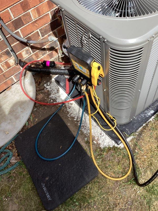 Completed full HVAC system installation including new air conditioning condenser unit and evaporator coil. Unit was positioned on concrete pad against building foundation with proper clearances maintained. Connected refrigerant lines with appropriate insulation, ran electrical connections per code requirements, and coordinated with licensed electrician for final power hookup. All necessary permits were obtained prior to installation. System was pressure tested, evacuated, and charged with refrigerant to manufacturer specifications. Performed comprehensive startup procedures and verified proper system operation using digital manifold gauges and testing equipment to confirm optimal performance parameters.