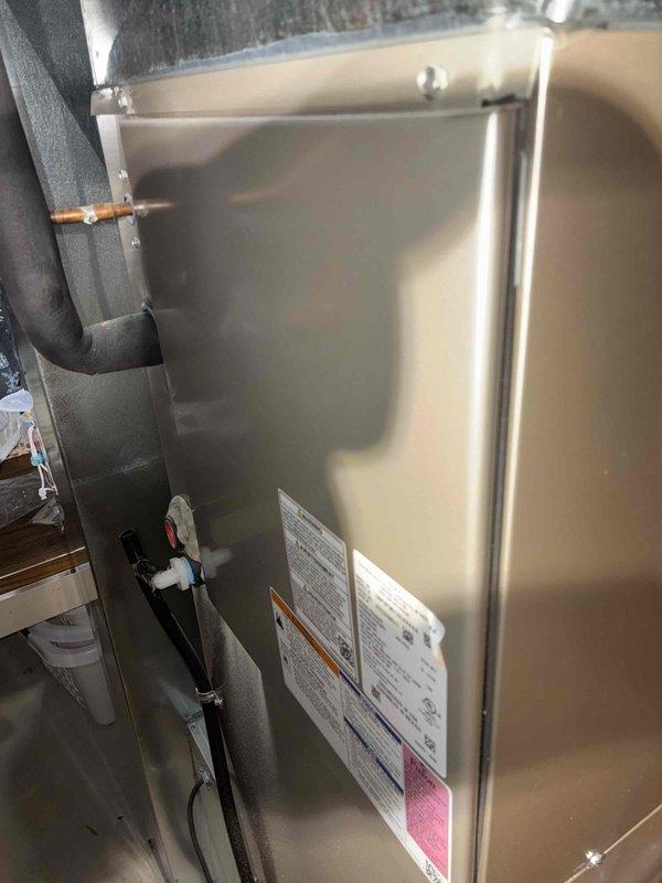 Completed routine cooling season tune-up and system inspection as part of recurring family membership service. Performed comprehensive diagnostics using digital testing equipment and manifold gauges to verify refrigerant pressures, temperatures, and overall system performance, recording 76.6°F at outdoor unit. Inspected indoor air handler unit in basement, checked all connections, verified proper insulation on refrigerant lines, and confirmed equipment labels and safety information were intact and legible. All systems operating within normal parameters with no issues identified.