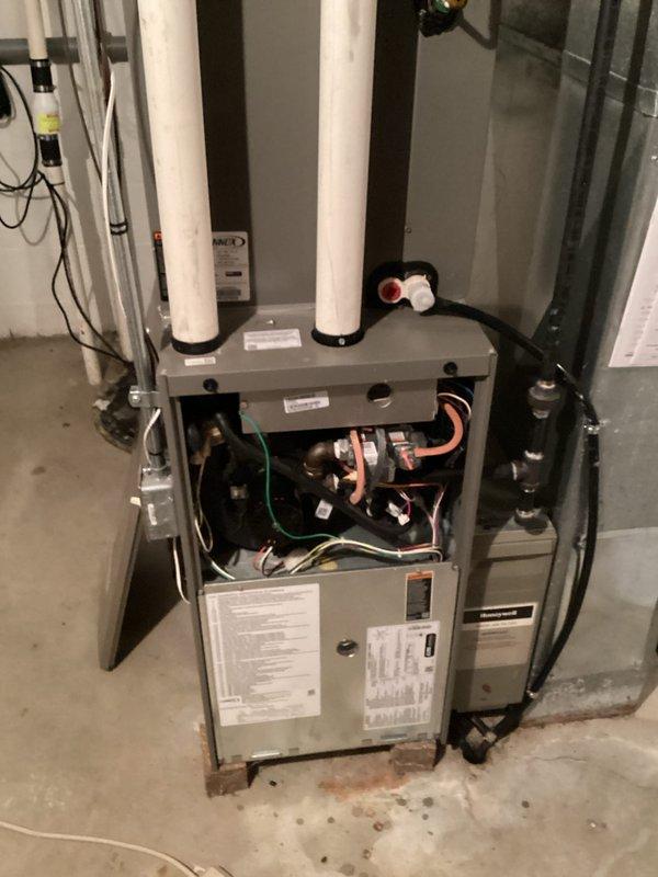 Completed comprehensive furnace and air conditioning tune-up on Lennox HVAC system. Performed thorough inspection of indoor furnace unit with all panels opened to access internal components, checked electrical connections, refrigerant lines, and condensate drainage system. Inspected outdoor condensing unit, tested system operation, and verified proper airflow through fan assembly and ventilation louvers.