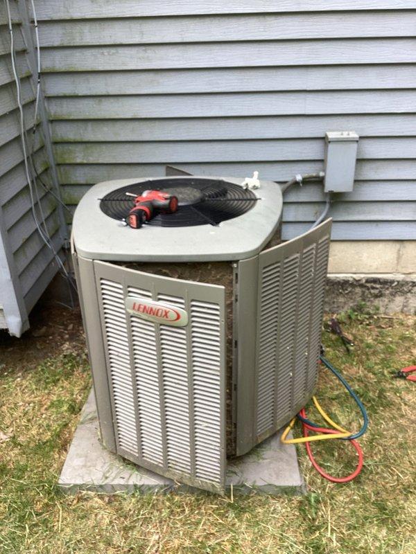Completed comprehensive furnace and air conditioning tune-up on Lennox HVAC system. Performed thorough inspection of indoor furnace unit with all panels opened to access internal components, checked electrical connections, refrigerant lines, and condensate drainage system. Inspected outdoor condensing unit, tested system operation, and verified proper airflow through fan assembly and ventilation louvers.