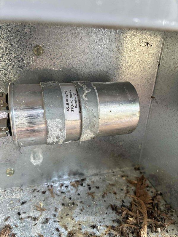 Completed routine cooling system maintenance as part of membership agreement. Performed comprehensive A/C tune-up including pressure diagnostics using manifold gauge set to verify refrigerant charge and system performance on outdoor condenser unit. Inspected indoor air handler components, noting dual-run capacitor rated at 454-517 MFD/370 VAC in good operating condition. Cleaned accumulated debris and organic matter from interior surfaces of air handler cabinet to ensure proper airflow and system efficiency. All system parameters found within normal operating specifications upon completion of preventive maintenance visit.