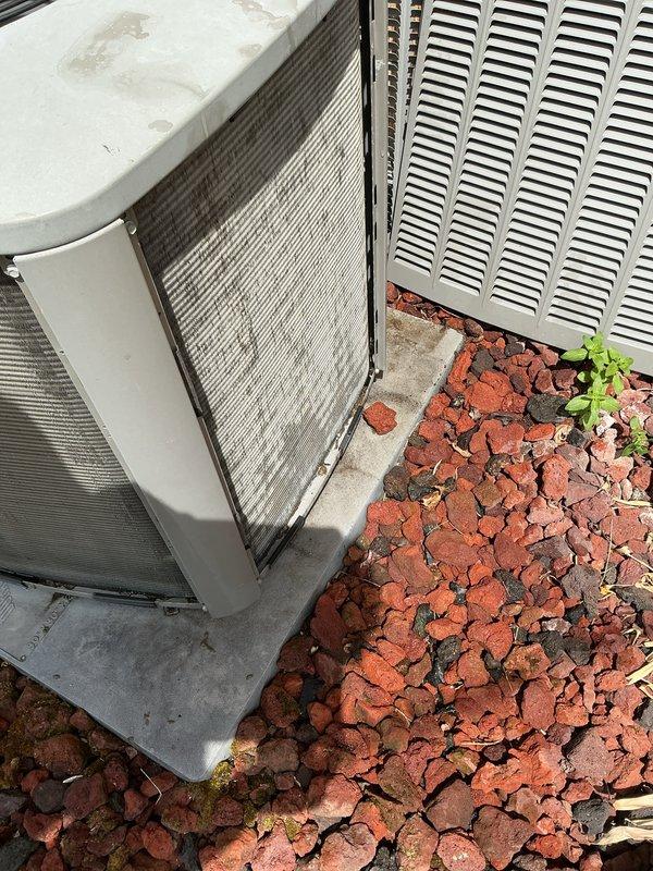 Completed air conditioning tune-up on outdoor condensing unit. Removed and inspected heavily soiled air filter showing significant dirt accumulation, indicating proper filtration but need for replacement. Performed standard maintenance procedures including system inspection, component cleaning, and verification of proper operation.