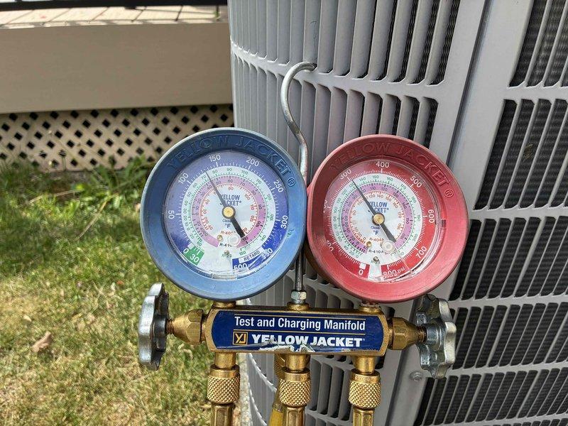 Performed comprehensive tune-up and diagnostic testing on Carrier outdoor condensing unit. Connected manifold gauge set to measure refrigerant pressures and verify system operating parameters within manufacturer specifications. Unit found operating properly with all components functioning as designed.