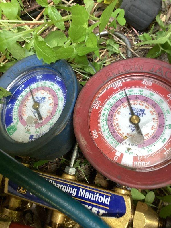 Completed comprehensive A/C tune-up service including system inspection and refrigerant pressure verification. Utilized manifold gauge set to check refrigerant levels and system pressures, confirming proper operating parameters. All components inspected and system operating efficiently.