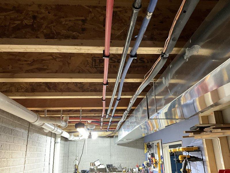 Completed estimate for air conditioning system replacement at residential property with existing natural gas furnace located in basement. Assessed current HVAC infrastructure including ductwork configuration and mechanical systems to provide replacement options for underperforming AC unit. Documented existing equipment and utility room setup with photos for proposal development.