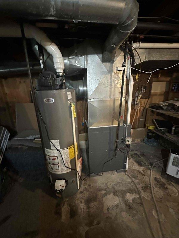 Conducted comprehensive assessment of aging residential HVAC system experiencing multiple operational issues. Evaluated existing furnace and air conditioning equipment located in basement utility area, documenting current system configuration including electrical service panel connections, ductwork layout, and equipment placement alongside water heater. Provided detailed replacement estimate for complete HVAC system upgrade to address reliability concerns and equipment age-related deterioration.