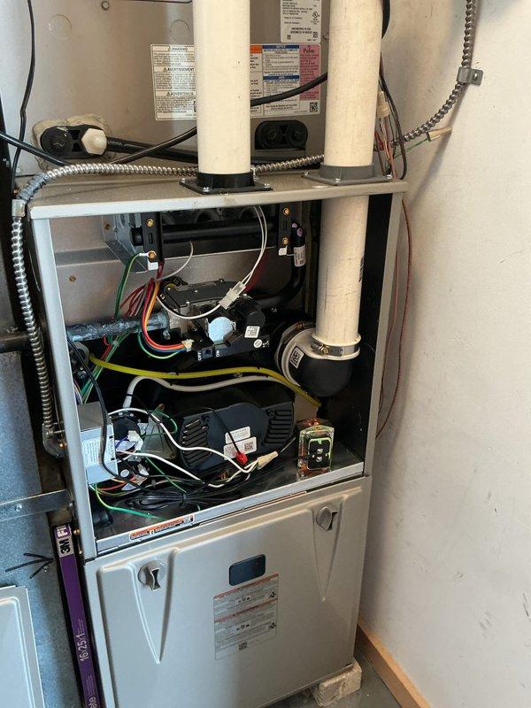 Completed furnace and air conditioning tune-up maintenance on residential HVAC system. Performed comprehensive inspection of furnace unit with blower motor, capacitor, and electrical components; verified proper operation of all internal systems. Inspected rooftop AC unit, checked refrigerant levels, cleaned condenser coils, and confirmed system performance; evaluated humidifier pad condition and replaced as needed per seasonal maintenance protocol.