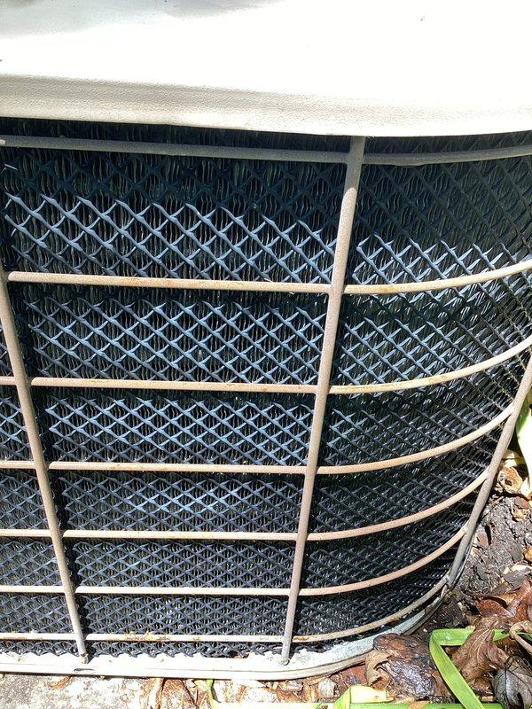 Completed comprehensive HVAC maintenance agreement service on split system including outdoor condenser unit and indoor air handler. Performed diagnostic testing with multimeter showing system voltage at 647.1V, conducted pressure readings using manifold gauges to verify refrigerant charge levels within manufacturer specifications, and inspected condenser unit exterior components including protective grille and mesh screening for proper airflow and debris clearance.