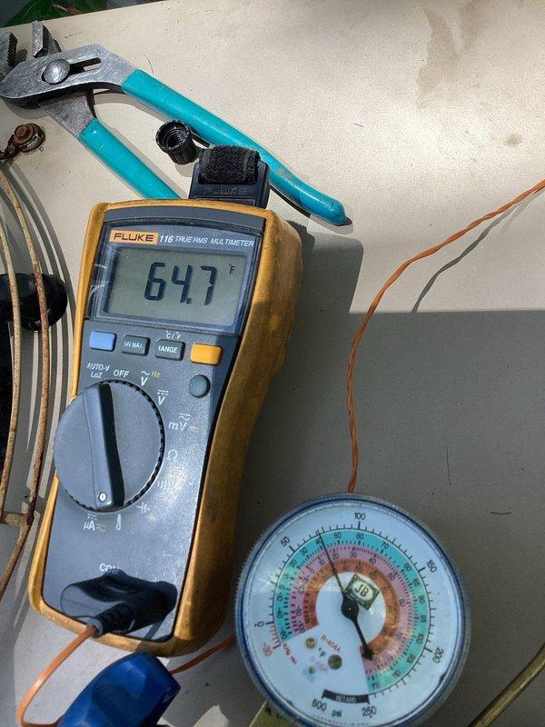 Completed comprehensive HVAC maintenance agreement service on split system including outdoor condenser unit and indoor air handler. Performed diagnostic testing with multimeter showing system voltage at 647.1V, conducted pressure readings using manifold gauges to verify refrigerant charge levels within manufacturer specifications, and inspected condenser unit exterior components including protective grille and mesh screening for proper airflow and debris clearance.