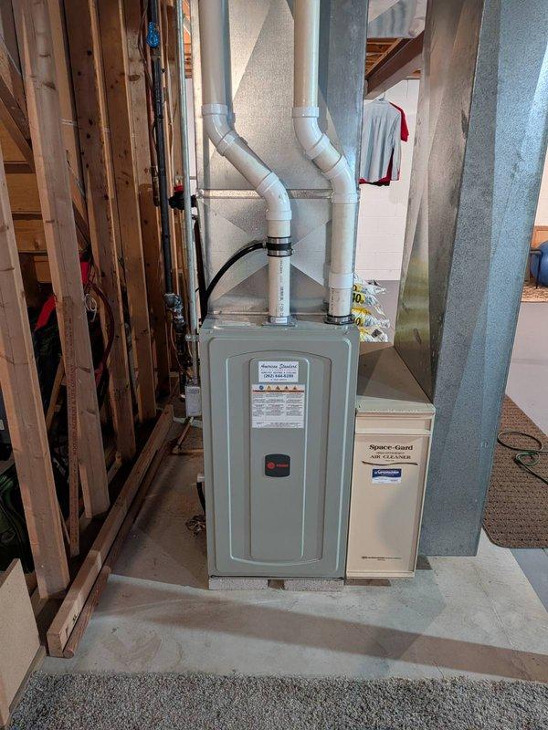 Completed furnace and air conditioning tune-up maintenance on residential HVAC system. Performed comprehensive inspection of outdoor condenser unit and indoor furnace with Space-Gard air filtration system, verified proper operation of all components, checked refrigerant levels, cleaned coils, inspected ductwork and ventilation, and confirmed system is operating within manufacturer specifications.