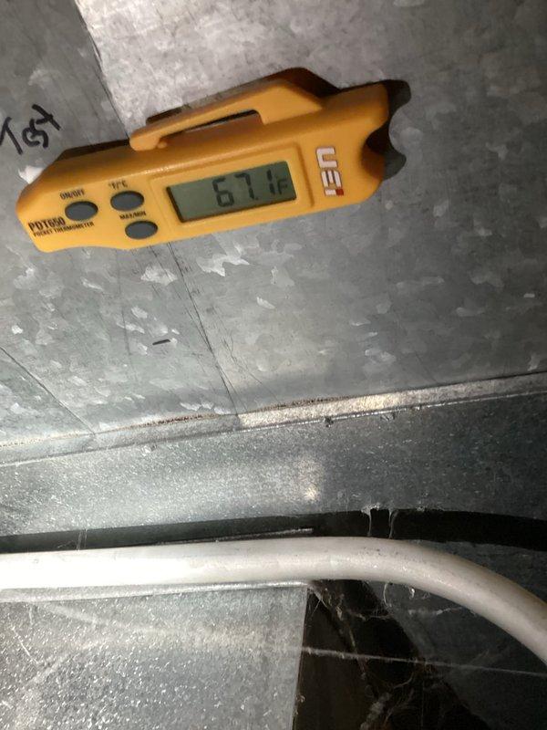 Completed semi-annual preventive maintenance inspection as part of prepaid membership service. Performed system diagnostics including supply air temperature measurements at ductwork, recording 67.0°F and 54.6°F readings to verify proper airflow and temperature differential across the HVAC system.
