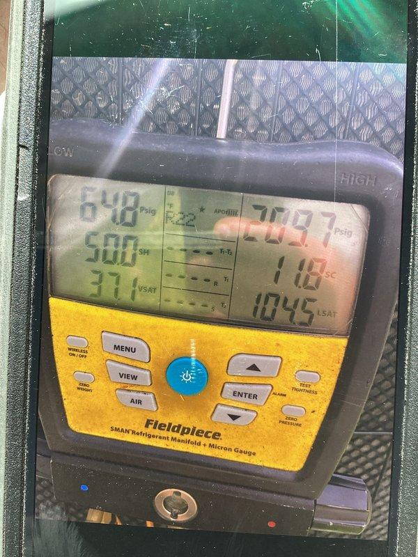 Completed prepaid cooling system maintenance visit on residential AC unit. Performed standard system diagnostics using Fieldpiece SMAN refrigerant manifold and micron gauge to verify refrigerant pressures and system performance. All measured values were within normal operating parameters. Inspected outdoor condenser unit, confirmed proper operation of fan assembly, and verified electrical connections were secure. System operating efficiently with no issues identified.