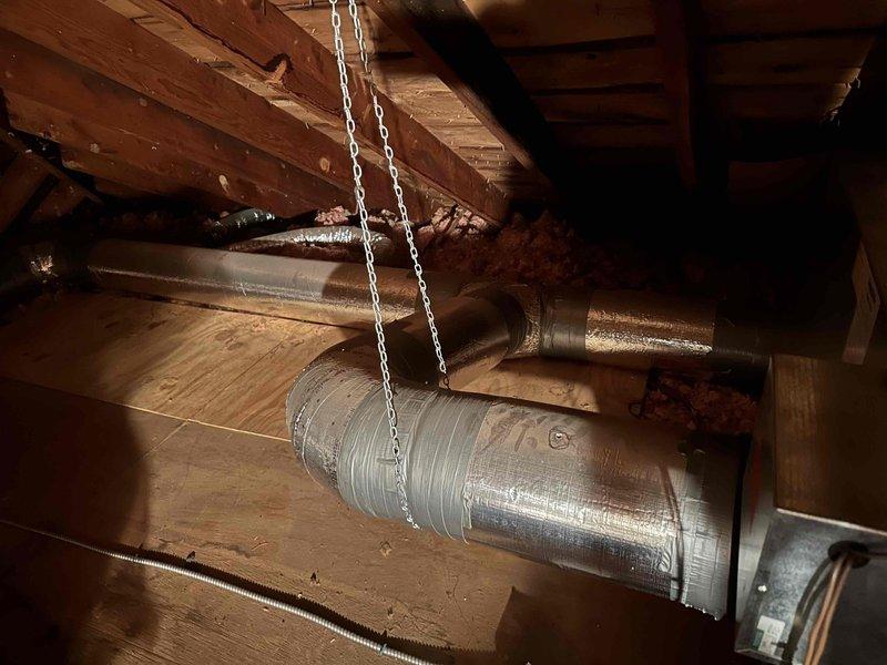 Responded to emergency service call for Unico system located in attic space. Arrived within scheduled window, conducted thorough inspection of existing ductwork and HVAC components, documented current system configuration with photos showing metallic flexible ductwork, exposed wooden framing, and insulation conditions to provide comprehensive estimate for complete system replacement.