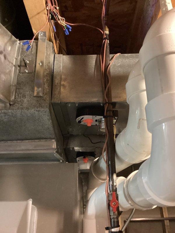 Responded to customer concern regarding inadequate cooling distribution in 3-zone system with open floor plan, where cold air was settling in basement while upper bedrooms remained warm. Inspected air handler unit and ductwork in attic space and evaluated zone control system and damper operations. Assessed return air flow patterns and identified insufficient return air pathways from basement level causing air stratification issues. Documented current HVAC equipment configuration including air handler, zone dampers, and existing ductwork layout with photos. Provided recommendations for improving air circulation including potential installation of additional return air grilles in basement, balancing dampers, or supplemental circulation fans to promote better air movement between levels and achieve more uniform temperature distribution throughout the home.