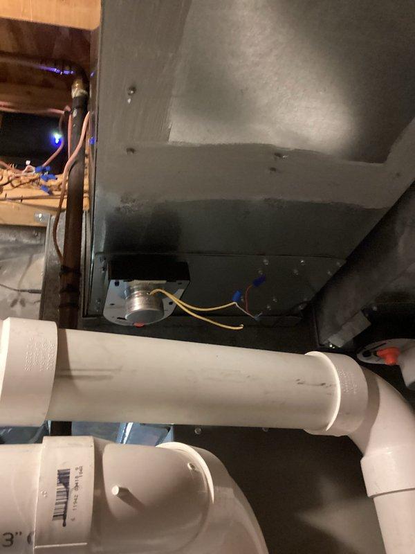 Responded to customer concern regarding inadequate cooling distribution in 3-zone system with open floor plan, where cold air was settling in basement while upper bedrooms remained warm. Inspected air handler unit and ductwork in attic space and evaluated zone control system and damper operations. Assessed return air flow patterns and identified insufficient return air pathways from basement level causing air stratification issues. Documented current HVAC equipment configuration including air handler, zone dampers, and existing ductwork layout with photos. Provided recommendations for improving air circulation including potential installation of additional return air grilles in basement, balancing dampers, or supplemental circulation fans to promote better air movement between levels and achieve more uniform temperature distribution throughout the home.