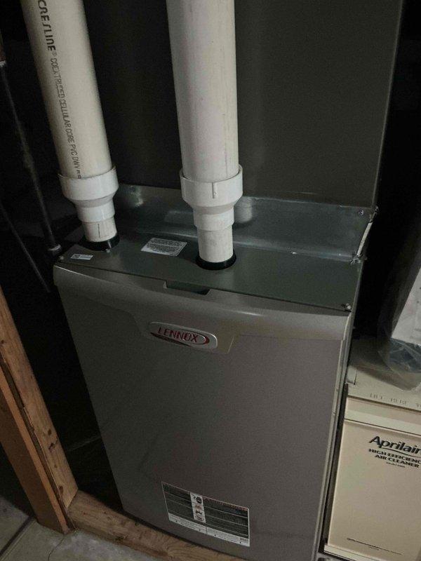 Completed routine cooling system maintenance visit as part of recurring membership agreement. Performed comprehensive inspection of Lennox furnace unit and outdoor condensing unit, verified proper operation of all components, checked refrigerant lines and connections, and documented equipment condition with photos for service records.