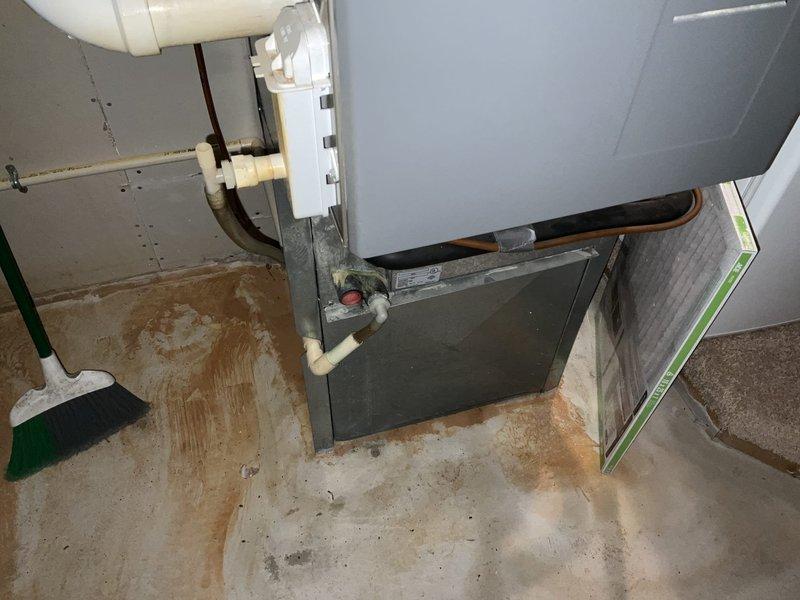 Completed estimate for replacement of existing Carrier furnace and air conditioning system located in upstairs closet. Assessed current HVAC equipment configuration, including furnace positioned in utility closet at top of stairs alongside water heater, documented existing installation conditions, and provided recommendations for new system installation to replace aging heating and cooling equipment.