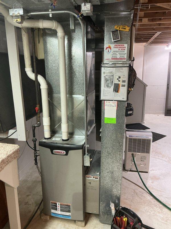 Completed preventive maintenance tune-ups on two furnace units and two air conditioning units in residential basement installation. Performed comprehensive system inspections including visual examination of all components, verification of proper operation, and documentation of equipment conditions. All units were found to be in operational condition with manufacturer labels and specifications clearly visible on equipment panels.