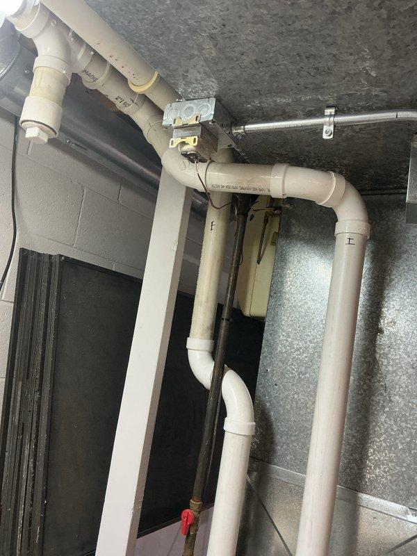 Completed preventive maintenance tune-ups on two furnace units and two air conditioning units in residential basement installation. Performed comprehensive system inspections including visual examination of all components, verification of proper operation, and documentation of equipment conditions. All units were found to be in operational condition with manufacturer labels and specifications clearly visible on equipment panels.
