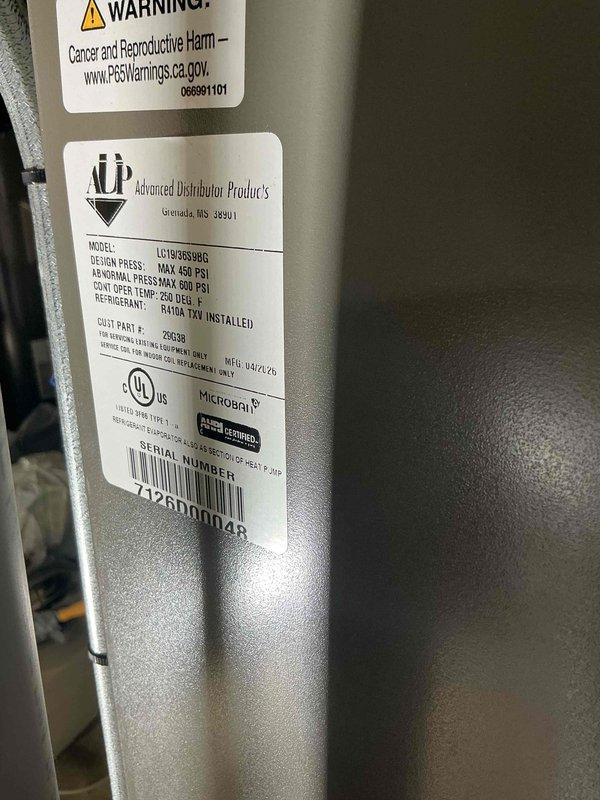 Installed new evaporator coil (Advanced Distributor Products model LO18165SMRS) rated for R410A refrigerant with factory-installed TXV, maximum design pressure of 450 PSI, and operating temperature of 250°F. Unit was properly positioned and all manufacturer labels and safety warnings were verified intact per code requirements.
