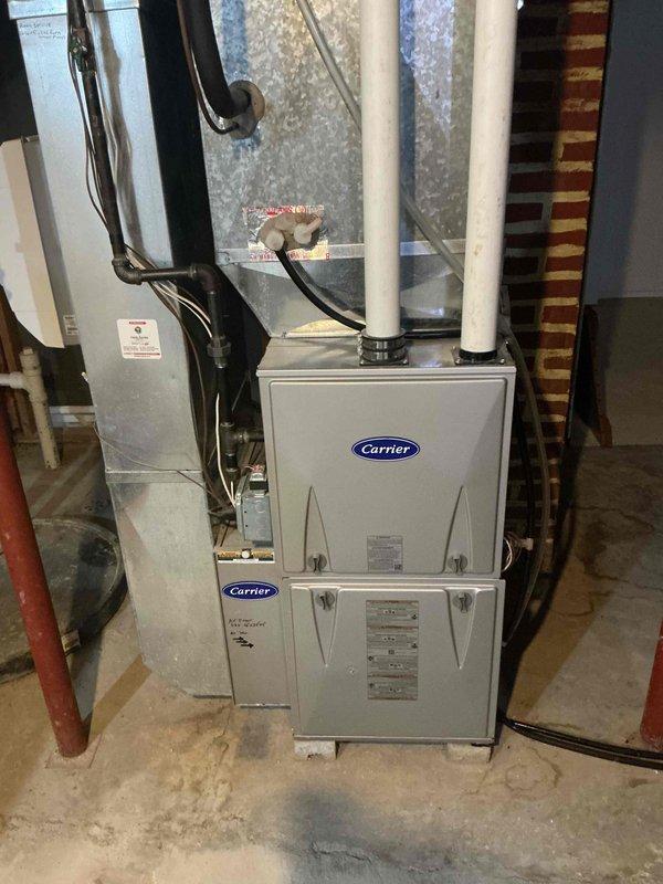 Completed comprehensive air conditioning tune-up service on residential Carrier HVAC system, including inspection of indoor air handler unit and outdoor condenser unit. Performed standard maintenance procedures, verified proper system operation, and provided estimate for duct cleaning services as requested.