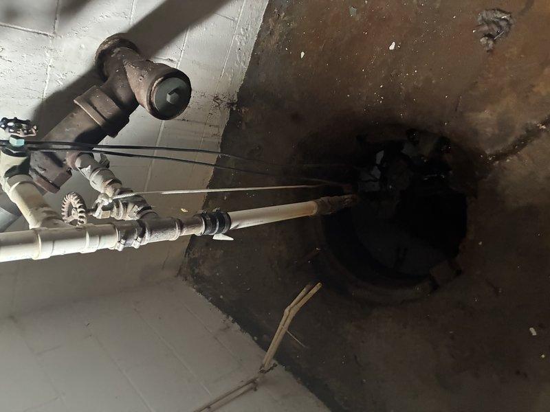 Relocated existing sump pump and crock assembly to new section of basement as requested. Installed new PVC discharge line with appropriate fittings and check valve to ensure proper drainage and prevent backflow. Verified system operation and confirmed adequate pump functionality in new location.