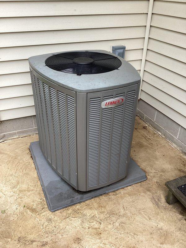 Completed annual tune-up and maintenance on Lennox outdoor condensing unit. Upon arrival, found significant debris accumulation on condenser coil fins including leaves, dirt, and organic matter concentrated along bottom edges and lower portions of unit. Cleaned condenser coils thoroughly, removed all debris from mesh filters and cabinet exterior, and restored proper airflow through heat exchanger. Performed standard maintenance protocol including refrigerant pressure checks, electrical connection inspection, amperage verification, and system operational testing. Unit returned to optimal operating condition with improved heat transfer efficiency following coil cleaning and comprehensive system evaluation.