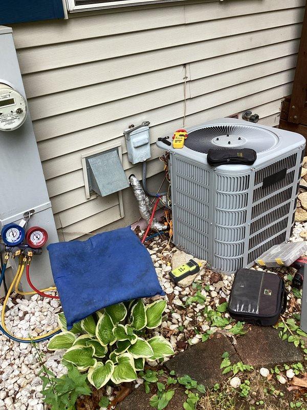 Performed comprehensive AC tune-up on residential condensing unit. Conducted refrigerant pressure diagnostics using manifold gauge set, verified system temperatures with digital thermometer reading 78.3°F, and inspected electrical disconnect and conduit connections. All components operating within normal parameters upon completion of preventive maintenance service.