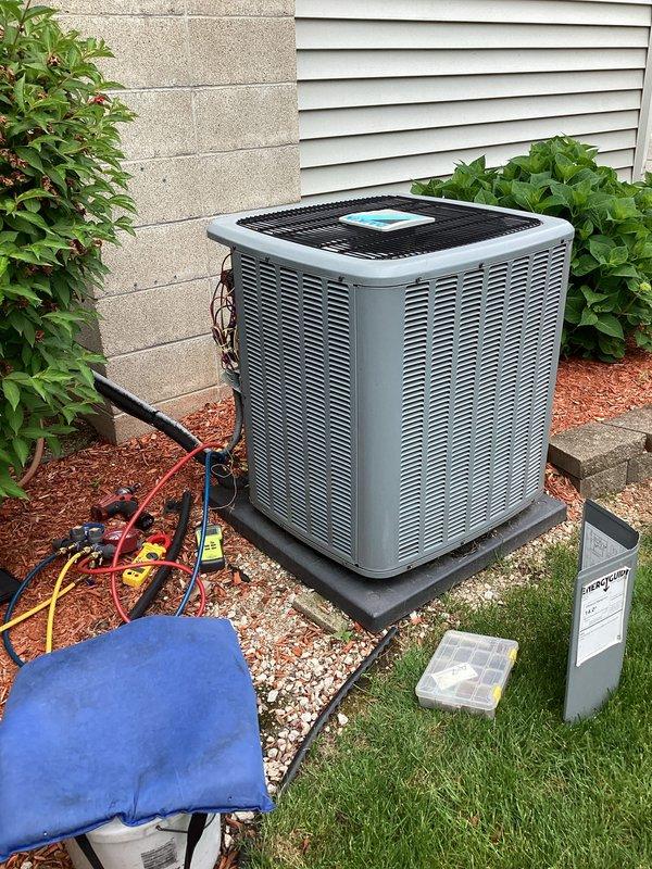 Performed comprehensive air conditioning tune-up on residential outdoor condensing unit. Connected manifold gauge set to measure refrigerant pressures, conducted electrical diagnostics with digital multimeter, and completed standard maintenance procedures to ensure optimal system performance and efficiency.