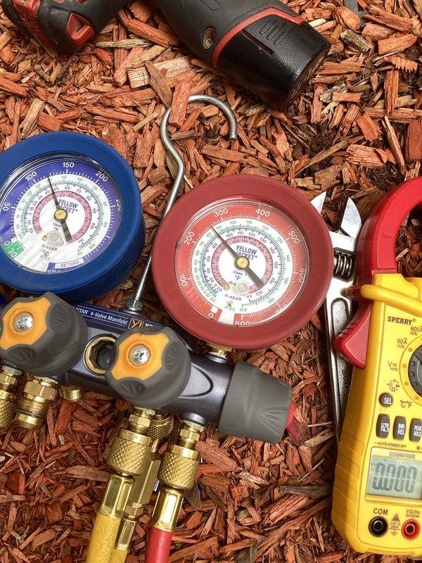 Performed comprehensive air conditioning tune-up on residential outdoor condensing unit. Connected manifold gauge set to measure refrigerant pressures, conducted electrical diagnostics with digital multimeter, and completed standard maintenance procedures to ensure optimal system performance and efficiency.