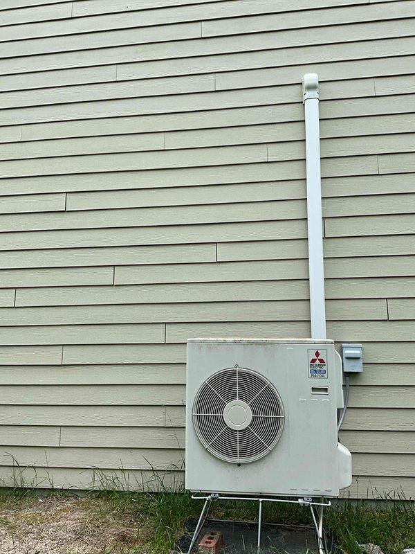 Completed estimate for one-to-one mini split replacement system. Evaluated existing Mitsubishi outdoor condenser unit mounted on metal stand with wall-mounted indoor unit, inspected electrical panel circuit configuration including dedicated AC compressor breaker, and documented current installation including refrigerant line routing and condensate drainage setup. Provided replacement system specifications and installation requirements.